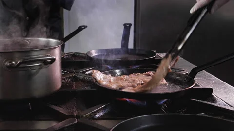 Professional restaurant kitchen close up - chefs team cooking meat Stock-Footage 152772221