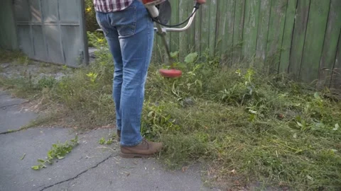 Professional roadside mowing. Utility worker with brush cutting for remove grass Stock Footage 151296764