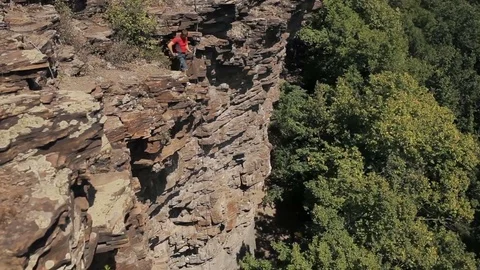 Professional rock climber on a cliff Stock Footage 83056416