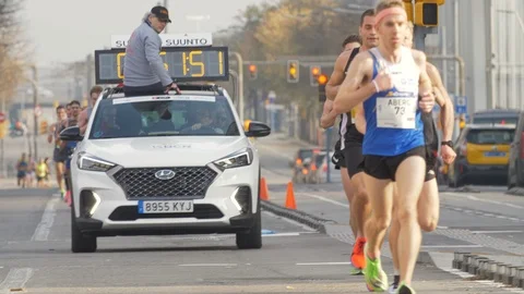 Professional Runners at the Head of a Half Marathon in Barcelona  First athletes Video stock 125120089