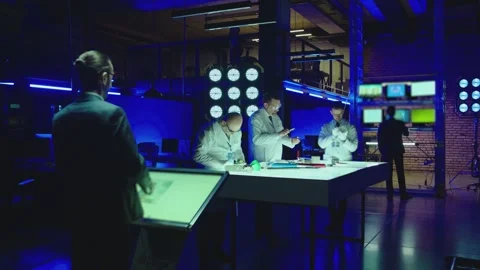 Professional scientists in white coats working in modern futuristic laboratory Stock Footage 201440308