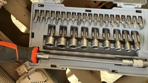 Professional screwdriver bit and socket set in a portable grey plastic case Stock Footage 328506368