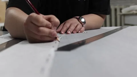 Professional seamstress making pattern with pencil Video stock 171004143