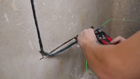 Professional Securing And Aligning Electrical Conductors Inside Wall Channels Stock-Footage 328521142