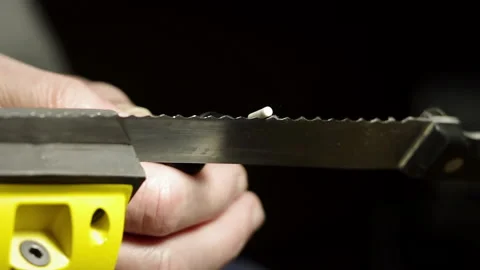Professional serrated knife blade sharpening with a rotary tool 스톡 동영상 130776250