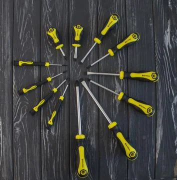 Professional set of screwdrivers on a gray background Stock Photos
