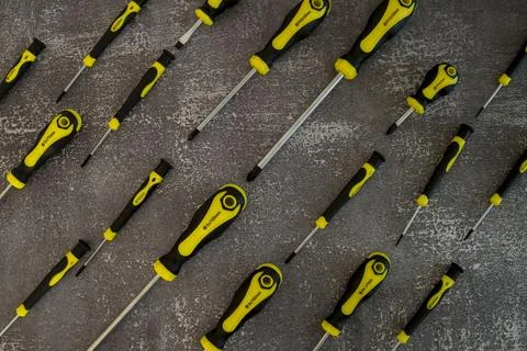 Professional set of screwdrivers on a gray background Stock Photos