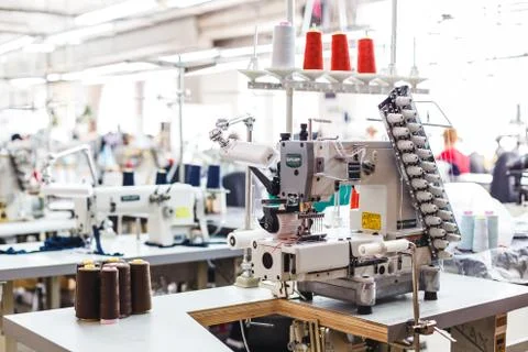 Professional sewing machine with different colors of threads Foto stock