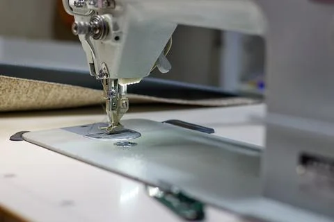 Professional sewing machine in the workplace. Stock Photos