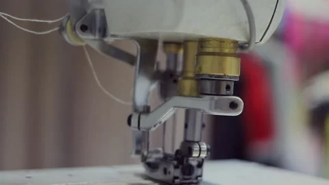 A professional sewing machine is in the workshop. Against the background of Stock Footage 133075895
