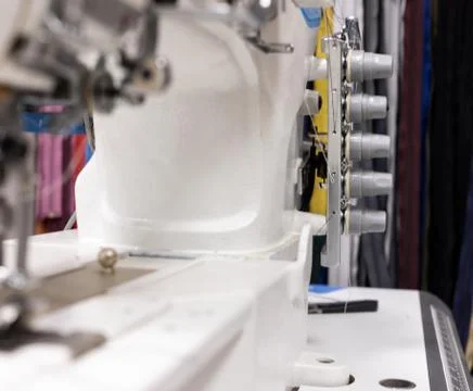 A professional sewing machine is in the workshop. Against the background of Stock Photos