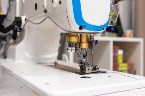 A professional sewing machine is in the workshop. Against the background of Stock Photos