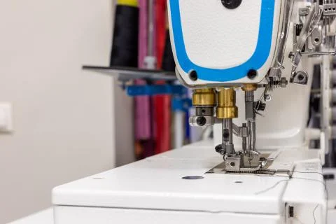 A professional sewing machine is in the workshop. Against the background of Stock-Fotos