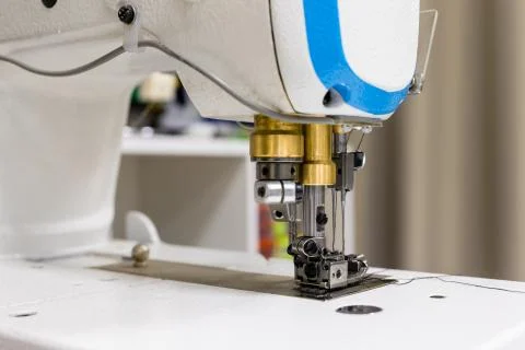 A professional sewing machine is in the workshop. Against the background of 스톡 사진