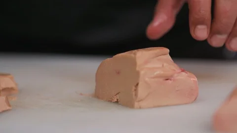 Professional сhef cutting foie gras on board with a knife preparation freshness Stock Footage 103287754