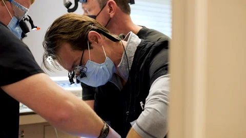 Professional shot of dentists operating Video stock 127001018