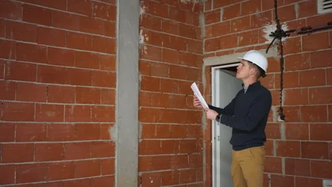 Professional site engineer conducting governance inspection in unfinished c.. Stock Footage 329641161