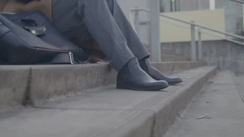 Professional Sits On Steps Outdoors Stock Footage 270336639