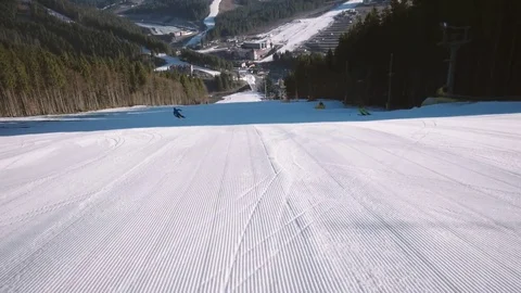 Professional Skier Carving Down the Snowy Slopes on the Mountain With Clear Video stock 74160519