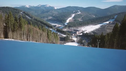 Professional Skier Carving Down the Snowy Slopes on the Mountain With Clear Stock Footage 74160652