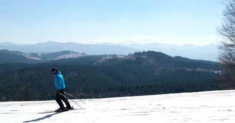 Professional Skier Carving Down the Snowy Slopes on the Mountain With Clear Stock Footage 74232575