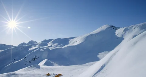 Professional skier cruising down remote mountainside Stock Footage 112001854