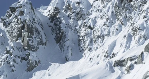 Professional skier gliding through remote mountain powder Stock Footage 111997730
