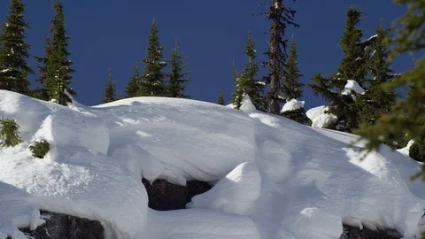 Professional Skier jumping downhill in high snowy mountains during winter Stock Footage 116784670