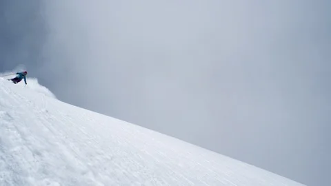 Professional skier skiing downhill during winter in slow motion Stock Footage 116631253
