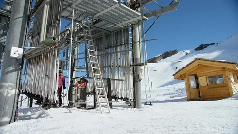 Professional skier skiing on snowy mountains on a sunny day Stock Footage 116788053