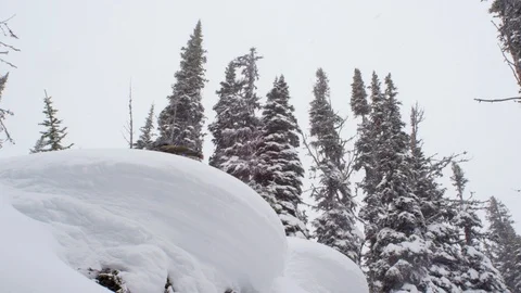 Professional skier spinning while jumping down the snowy slope Stock Footage 116738789