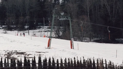 Professional skier wags and going down hill with hand lift view Video stock 73636166