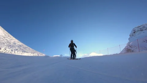 Professional skiers skiing fast ski turns on perfect ski slope Stock Footage 170481353