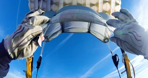 Professional skydiver opening parachute (point of view) Stock Footage