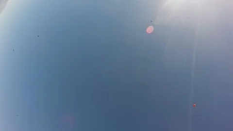 Professional skydiver opens parachute in sky. Sunny day. Adrenaline. Horizon. Stock Footage 95097106