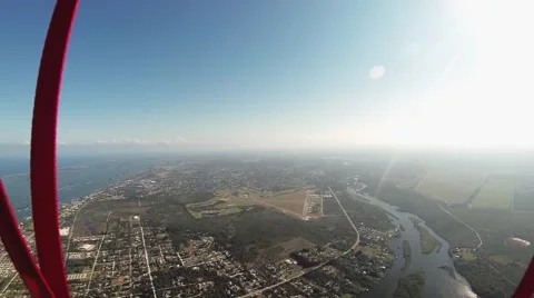 Professional skydiver parachuting above flatland. Landscape. Extreme hobby Видео 68898630
