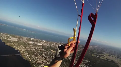 Professional skydiver parachuting above flatland. Landscape. Sunny day. River Stock Footage 68898681