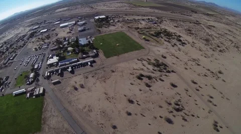 Professional skydiver parachuting above sandy arizona. Landscape. Landing. Sunny Stock Footage 68897779