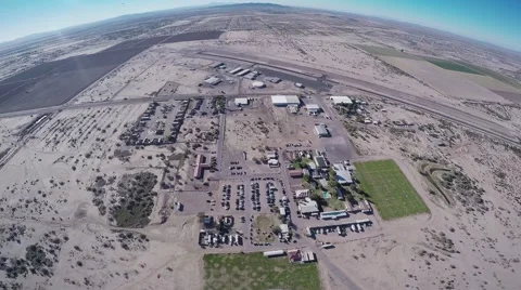 Professional skydiver parachuting in blue sky above Arizona. Sunny. Landscape Stock Footage 66545344