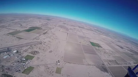 Professional skydiver parachuting in sky over Arizona. Sunny. Landscape. Horizon Video stock 66545586