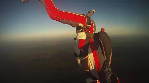 Professional skydivers freestyle in sky on sunset. Opening parachute. Adrenaline Video stock 68508083
