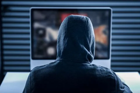 Professional smart gamer looking at the computer screen Stock Photos