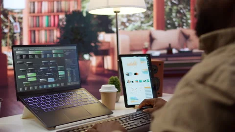 Professional software developer at desk working on AI coding Stock Footage 277838596