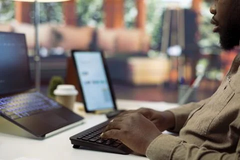 Professional software developer at his desk working on AI coding Stock Photos