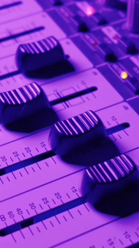 Professional Sound Console Faders Under Atmospheric Neon Blue Studio Lighting Stock Footage 334739183