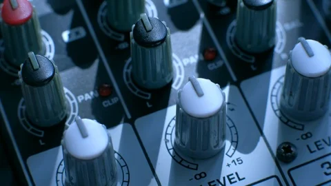 Professional sound engineer balancing volume of audio inputs digital audio mixer Stock Footage 106509025