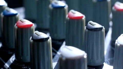Professional sound engineer balancing volume of audio inputs digital audio mixer Stock Footage 106509089