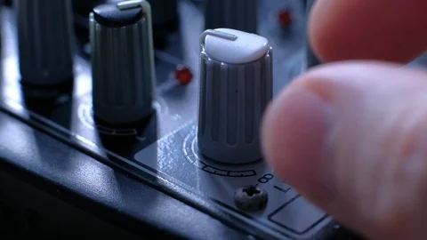 Professional sound engineer balancing volume of audio inputs digital audio mixer Stock Footage 106566532