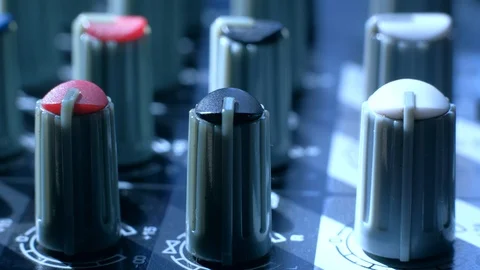 Professional sound engineer balancing volume of audio inputs digital audio mixer Stock Footage 106566586