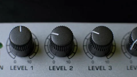 Professional sound engineer balancing volume of audio inputs digital audio mixer Stock Footage 133341759